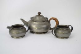 Pewter Tudric tea pot, milk jug and sugar bowl made for Liberty & Co