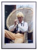 DAVID BOWIE David sat on a wicker chair. Measures 37 by 27”. Denis O’Regan is an English