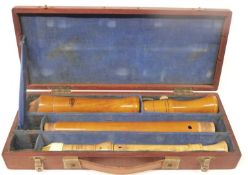 An antique recorder in wooden case by Johannes Adler and another example by Schotts.