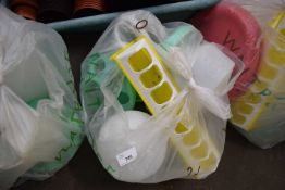 BAG OF PLASTIC POULTRY DRINKERS AND FEEDERS