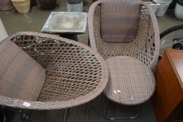 TWO RATTAN EFFECT GARDEN CHAIRS AND ACCOMPANYING TABLE
