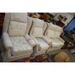 BEIGE FLORAL UPHOLSTERED TWO-SEATER SOFA AND PAIR OF ARMCHAIRS