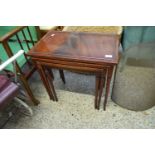 NEST OF THREE MAHOGANY VENEERED TABLES