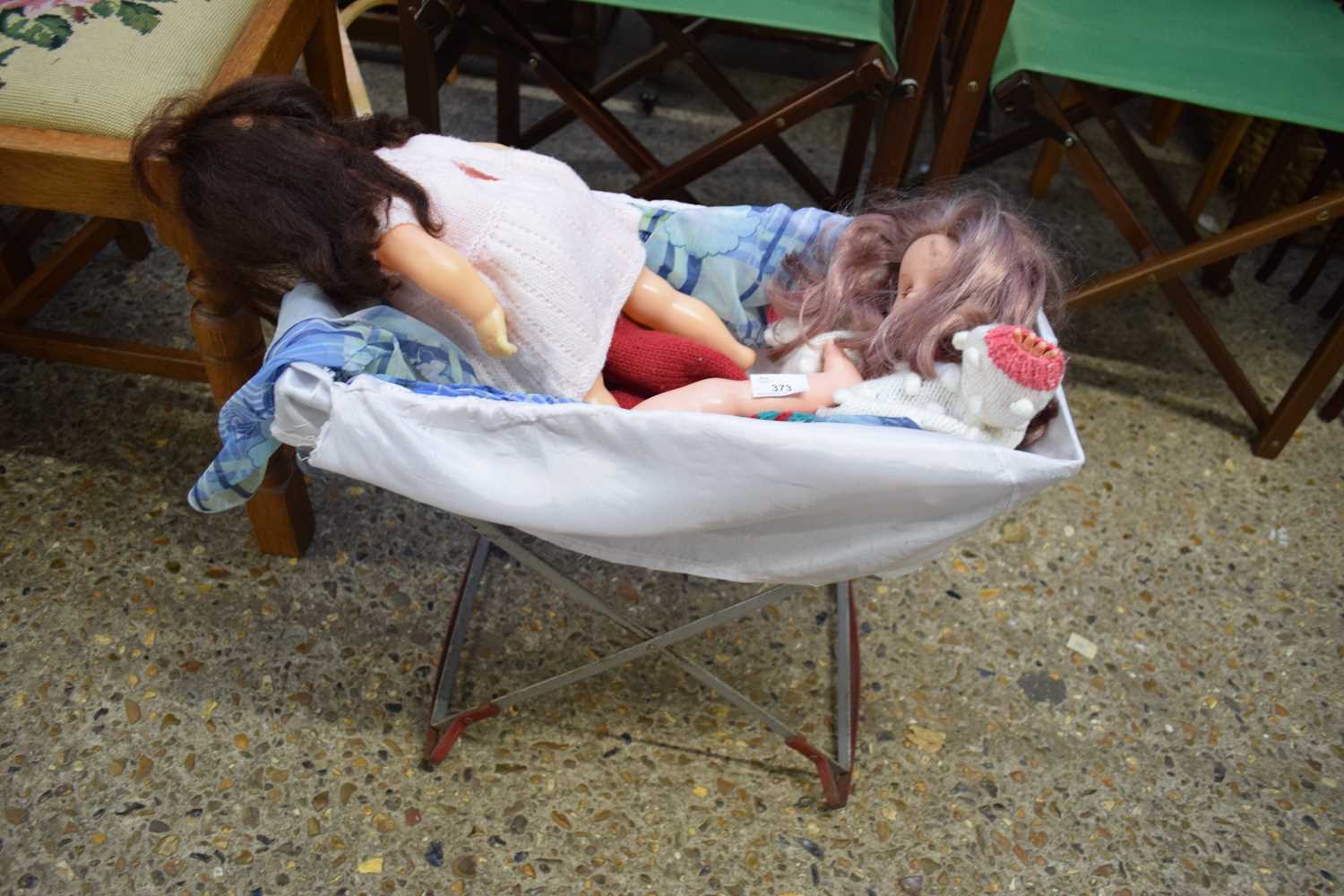 FOLDING DOLLS COT CONTAINING TWO DOLLS