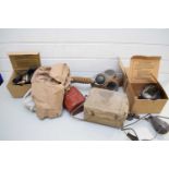 FOUR VINTAGE WORLD WAR BOXED RESPIRATOR GAS MASKS TOGETHER WITH A FURTHER LARGER EXAMPLE