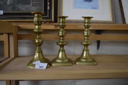 THREE BRASS CANDLESTICKS