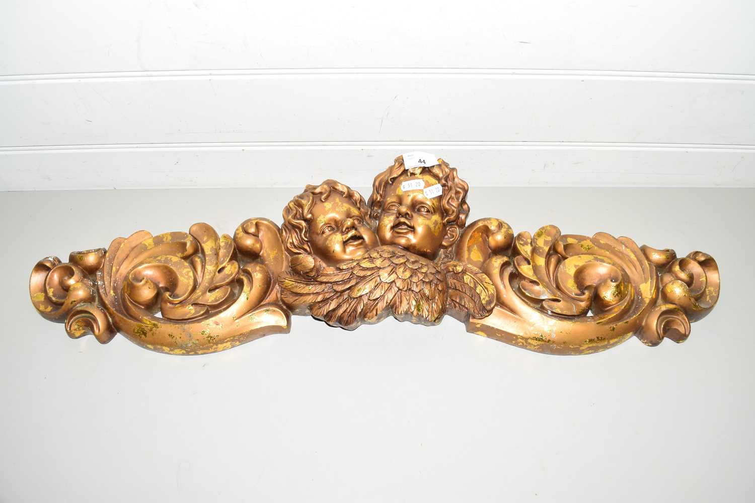 COMPOSITION GILT FINISH PEDIMENT DECORATED WITH TWO CHERUBS