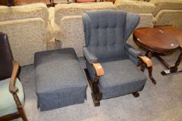 EARLY 20TH CENTURY BLUE UPHOLSTERED WING BACK ARMCHAIR AND ACCOMPANYING FOOT STOOL