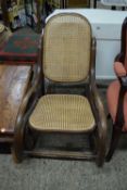 BENTWOOD FRAME CANE SEATED AND BACKED ROCKING CHAIR