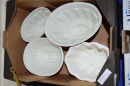 FOUR POTTERY JELLY MOULDS