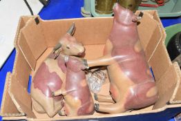 BOX CONTAINING THREE PAINTED WOODEN MODELS OF COWS