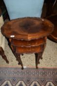 NEST OF THREE MAHOGANY EFFECT OCCASIONAL TABLES, LARGEST WIDTH APPROX 64CM