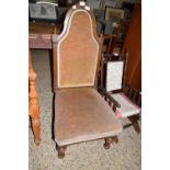 LATE VICTORIAN WALNUT FRAMED NURSING CHAIR WITH ARCHED BACK AND MUSHROOM UPHOLSTERY