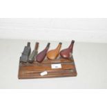 SET OF REPLICA GOLF CLUBS ON WOODEN MOUNT