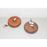 TWO VINTAGE TAPE MEASURES, BOTH MARKED 'TREBLE, ENGLAND', IN LEATHER CASES