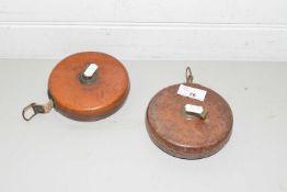 TWO VINTAGE TAPE MEASURES, BOTH MARKED 'TREBLE, ENGLAND', IN LEATHER CASES