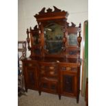 IMPRESSIVE BOW FRONT MAHOGANY SIDE CABINET WITH MIRRORED BACK, HEAVILY CARVED DETAIL THROUGHOUT,