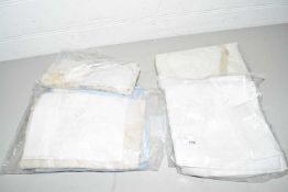 FOUR PLASTIC BAGS CONTAINING EMBROIDERY