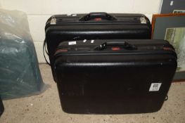 TWO MOULDED SUITCASES