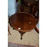 REPRODUCTION MAHOGANY EFFECT SCALLOP EDGE TABLE WITH BALL AND CLAW FEET, APPROX 64CM DIAM