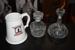 TWO DECANTERS AND A WHITE WATER JUG