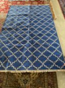 Modern blue rug with white geometric pattern, 278 x 178 cm (condition good)