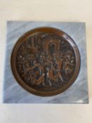 Circular relief bronze plate, 17cm D, depicting the Grand Tour, mounted within a marble plaque