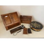 Hardwood stationery cabinet, a desk tidy, a tooled and gilt leather pen try and inkwell, a painted
