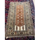 A Prayer Rug, the tan Mihrab with floral motifs and ivory spandrels within a beige border 176x 110