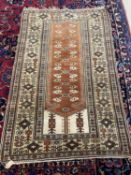 A Prayer Rug, the tan Mihrab with floral motifs and ivory spandrels within a beige border 176x 110