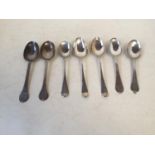 seven hallmarke silver dessert spoons all engraved including a pair of Victorian T B & S. Crested