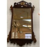 Rectangular bevelled glass wall mirror, set within a mahogany rectangular frame, surmounted with a