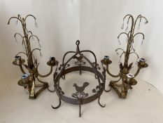 Candelabra with lustres, and a hanging metal dome with hooks and chicken motifs