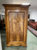 Good C19th light polished French fruitwood armoire fitted with 3 adjustable shelves and panelled