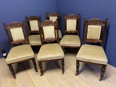 Set of 6 Victorian carved mahogany dining chairs with upholstered seats and backs on castors (