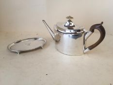 Jersey silver tea pot and stand gross weight 28.4 ozt including handles. Both engraved with the Arms
