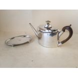 Jersey silver tea pot and stand gross weight 28.4 ozt including handles. Both engraved with the Arms