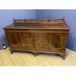 Large early C20h carved mahogany sideboard, 3 drawers flanked by cupboards on ball and claw feet