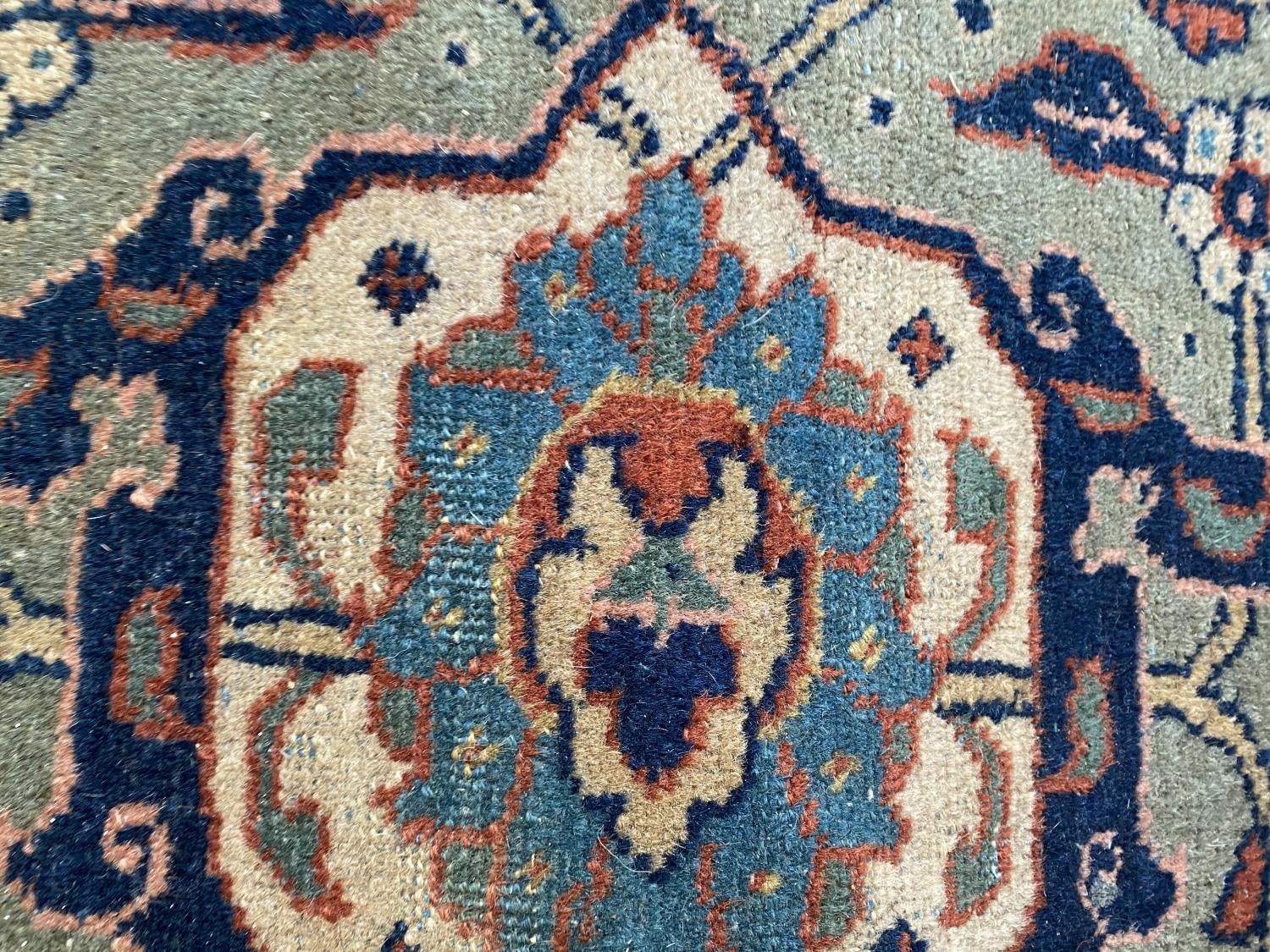 Large old Persian rug with dark blue ground and central panel within a green stylised rectangular - Image 7 of 8