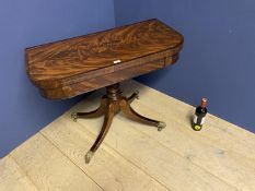 Regancy figured mahogany card table supported by 4 sweeping legs leading to canthus leaf brass