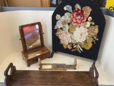 Two book slides, a tapestry/needlepoint covered screen, a small toilet mirror and a pair of brass