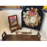 Two book slides, a tapestry/needlepoint covered screen, a small toilet mirror and a pair of brass