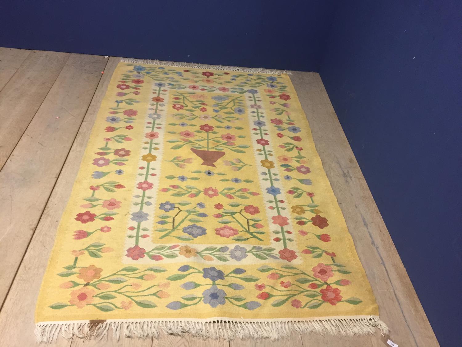 Modern yellow ground rug, with floral patterns