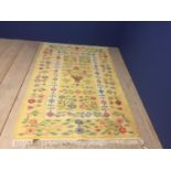 Modern yellow ground rug, with floral patterns