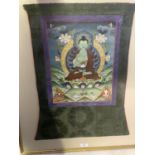 Framed and glazed Tibetan Thangka, mounted within a green and purple fabric mount, size including