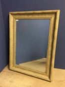 Rectangular bevelled wall mirror, set within a cream/washed decorative frame88cm H x68cmW overall