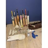 Cricket bag with various bats (non English Willow, all worn), various gloves, cricket spikes etc, (