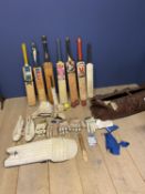 Cricket bag with various bats (non English Willow, all worn), various gloves, cricket spikes etc, (