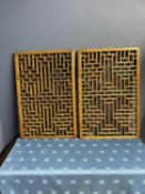 Pair of decorative mahogany oblong geometric pattern wall panels (condition, minor wear, one frame