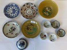 Group of Chinese and Japanese saucers, cups and a bowl